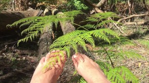 In the deep bush land where no one goes is a man playing with his extra long toes - MANLYFOOT
