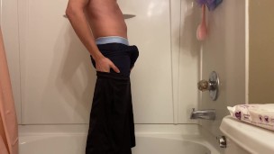 Naughty young man masturbates in the shower