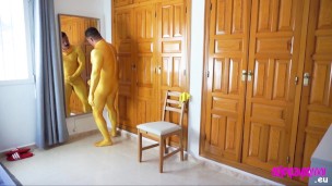 Muscle man playing in full zentai suit