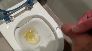 Uncut cock pisses at public toilet through big foreskin and dribbles on underwear