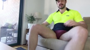Construction worker takes off pants on couch revealing big cut cock and sniffs dirty underwear