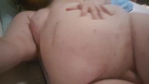 Chubby plays with his fat belly