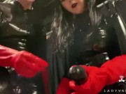 Trailer - Latex Dommes Invite You To Suck Their Huge Strap Ons 15/16