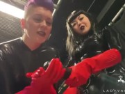 Trailer - Latex Dommes Invite You To Suck Their Huge Strap Ons 4/16