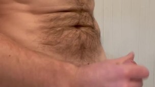 Vocal muscled man jerks off his huge cock