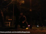 She drinks piss and cum in a public park while traffic passes 2/16