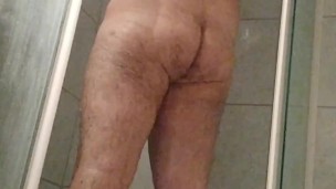 Chubby in chastity takes a shower