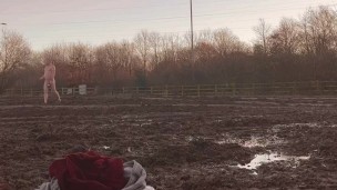 Naked barefoot muddy field