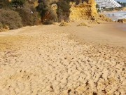 Hot brunette risks masturbating on a public beach while doing her exercise 4/16