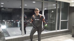 quick walk to hotel elevators in orca wetsuit, silicone mask and massive hardon