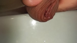 extreme close up foreskin of uncutted cock while peeing