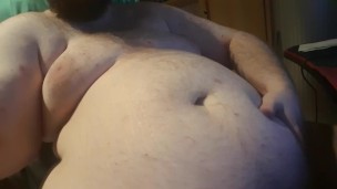 Chubby plays with his bellybutton
