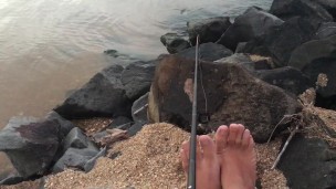 Rod in hand skinny dipping in the lake cheeky day with my feet - Manlyfoot Roadtrip - Sock sniffing