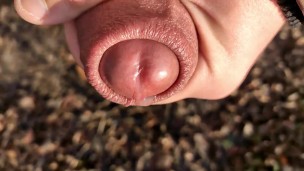 Uncut cock cums close up outside