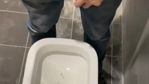 Man peeing in toilet 
