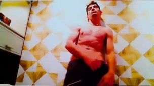 Sexy jock jerks off his huge cock on camera