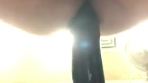 Guy taking huge black dildo