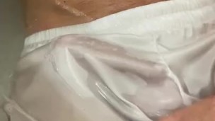 Playing with cock in bath, in white wet undies 