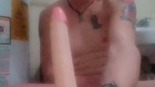 Twink rides 7" dildo in bathroom 