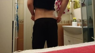 I show a hairy cock with a weight on my balls