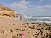 Horny girl and guy undress on a public beach and masturbate - risky