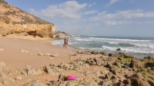 Horny girl and guy undress on a public beach and masturbate - risky