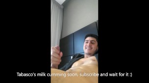 Handsome man oils his thick pink boner