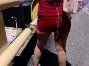 desperate urinates while walking down the street in her little red dress