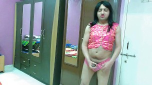 Sexy sissy crossdresser femboy in pink traditional top and pantie.