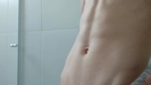 boy plays with the stick in the bathroom
