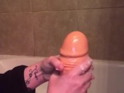 Oiling up my thick dildo