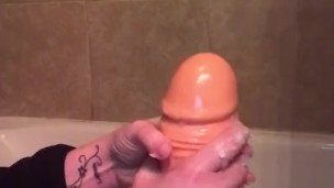 Oiling up my thick dildo