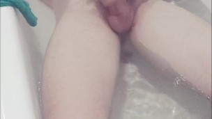 Lying in the bath playing and smoking