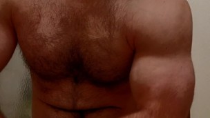 HAIRY MUSCLE BEAR FLEXING BEFORE SHOWER