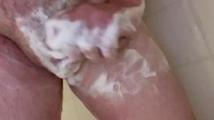 Soaping up my cock in the shower for a minute .