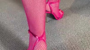 Pink bodystocking and heels 