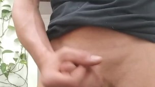 Leaning back and letting go. Fit male jerks off with you.