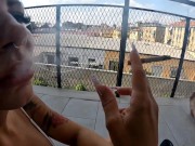 Two girlfriends smoke a cigarette 10/16