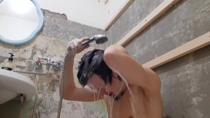 hot muscular guy washes in the shower 4k video