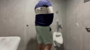 Public restroom peeing with pants down 