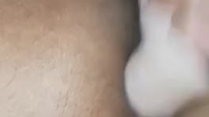 Masturbating