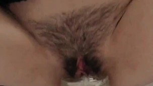 Girl in black stockings filled a large jar of urine. 4th ovulation test / Pissing