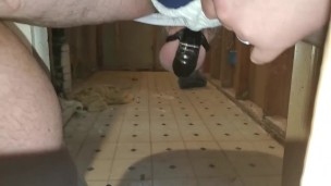 Frustrated slave rattles cage and shows off his hole