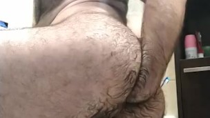 Fit hairy man fists his hot tight ass in the bathroom