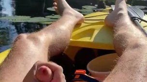Hairy daddy long legs pumps his tight uncut cock in a kayak