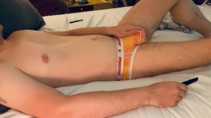 Guy next door watches TV, strips and jerks his tight uncut cock til it explodes on his chest.