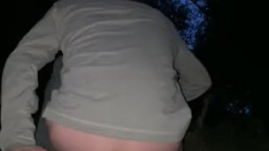 Riding big dildo on park trail