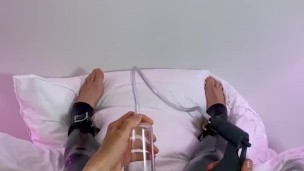 Latex boy pumps his cock hard with penis pump before jerking off