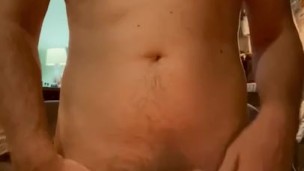 Canadian guy jerks his tight uncut cock in the candlelight until he explodes