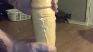 Milf oiling up thick dildo